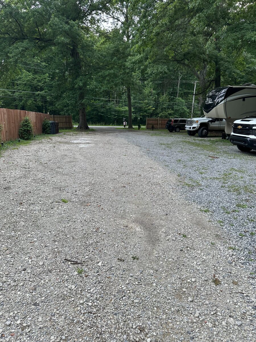Gravel access lane and RV spaces at Prairie House