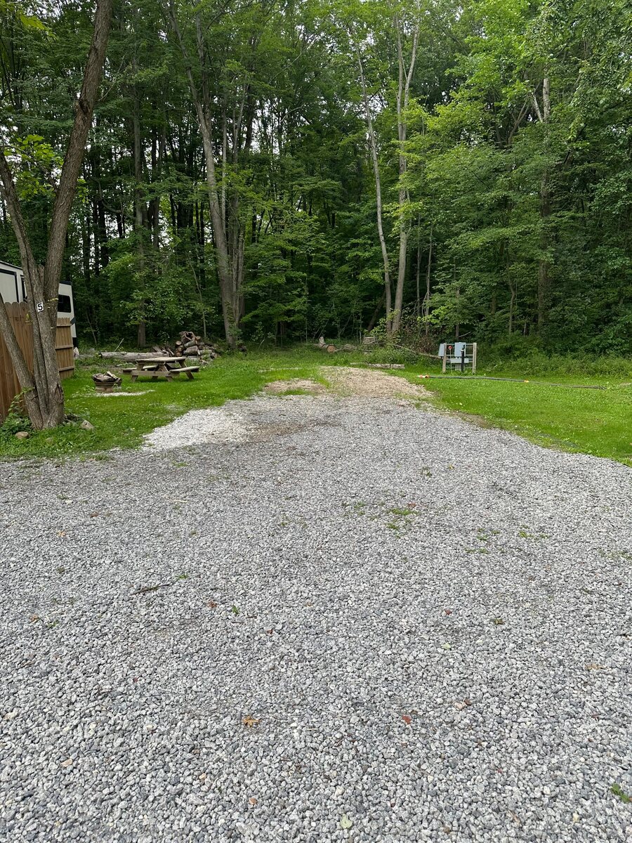Wooded RV space with a picnic area at Prairie House